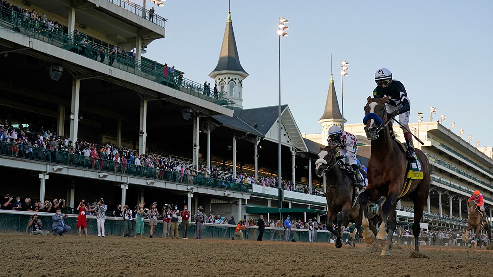 Jockey John Velazquez riding Authentic crosses the finish line to win the 146th running of the Kentucky Derby at Churchill Downs, in Louisville, Kentucky, Sept. 5, 2020.