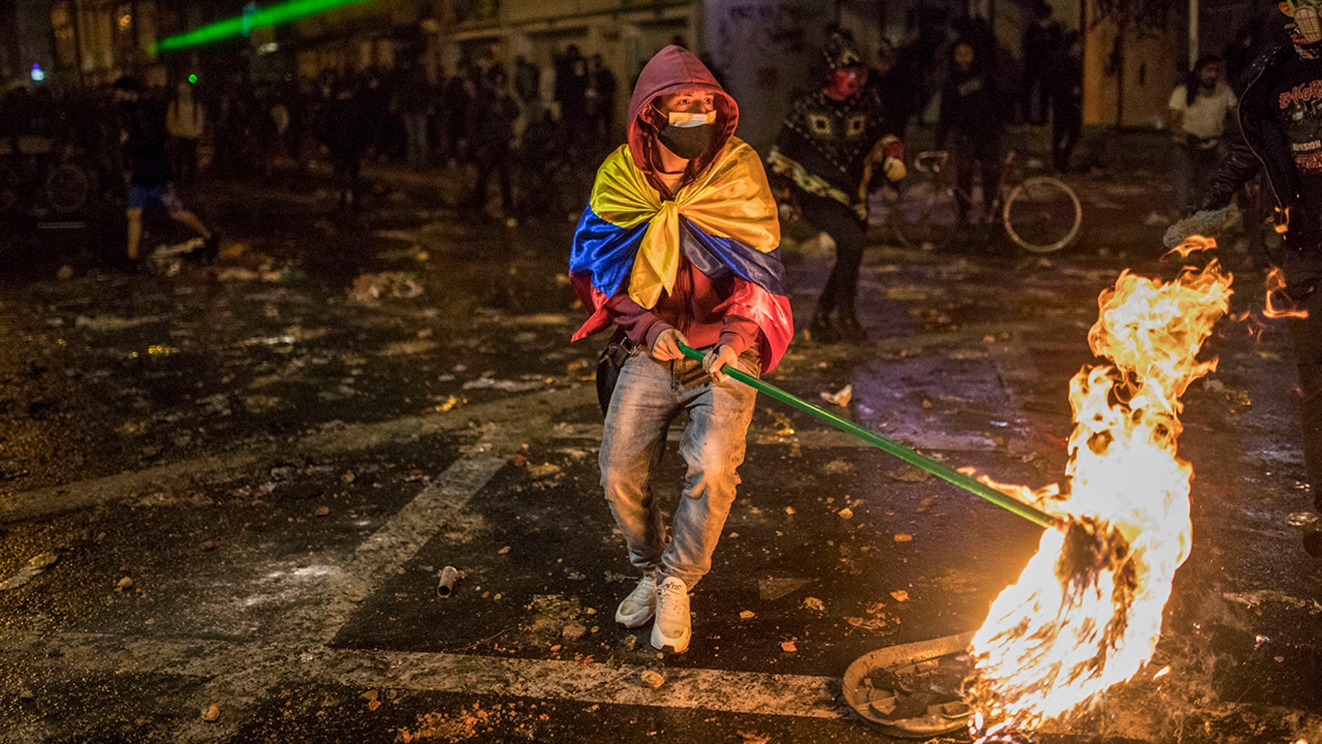 Demonstrators clash with police during protests sparked by the death of a man after he was detained by police in Bogota, Colombia, Sept. 9, 2020.