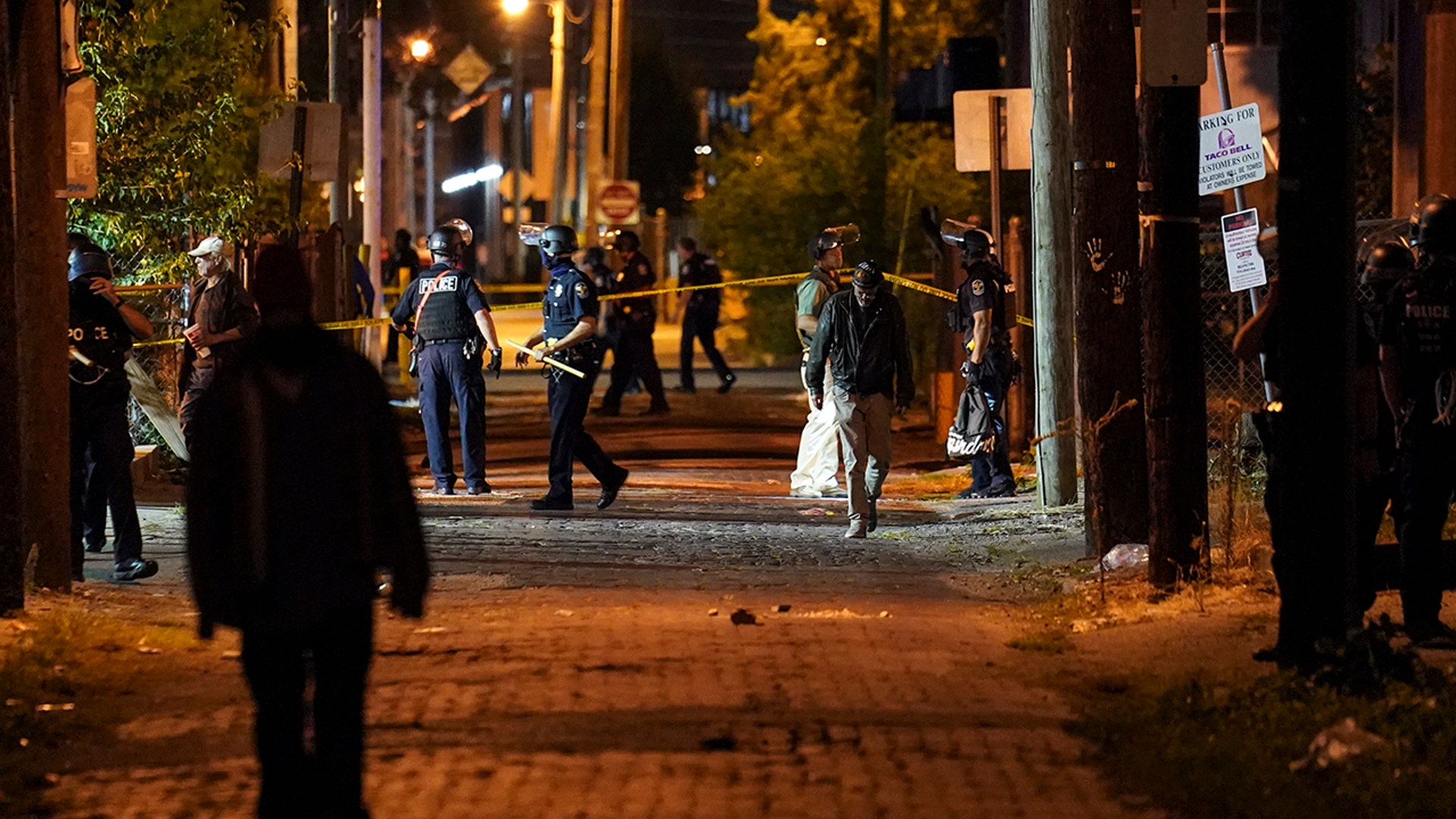 Police survey an area after a police officer was shot, Wednesday, Sept. 23, 2020, in Louisville, Ky. A grand jury has indicted one officer on criminal charges six months after Breonna Taylor was fatally shot by police in Kentucky.
