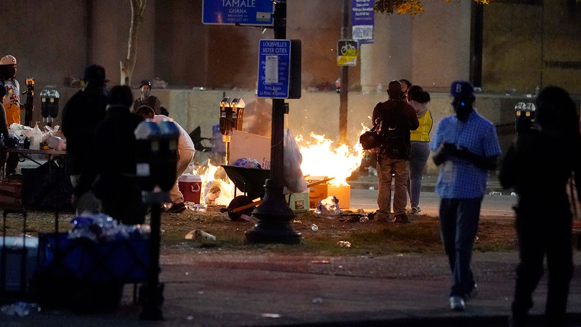 A fire burns downtown, Wednesday, Sept. 23, 2020, in Louisville, Ky. A grand jury has indicted one officer on criminal charges six months after Breonna Taylor was fatally shot by police in Kentucky. 