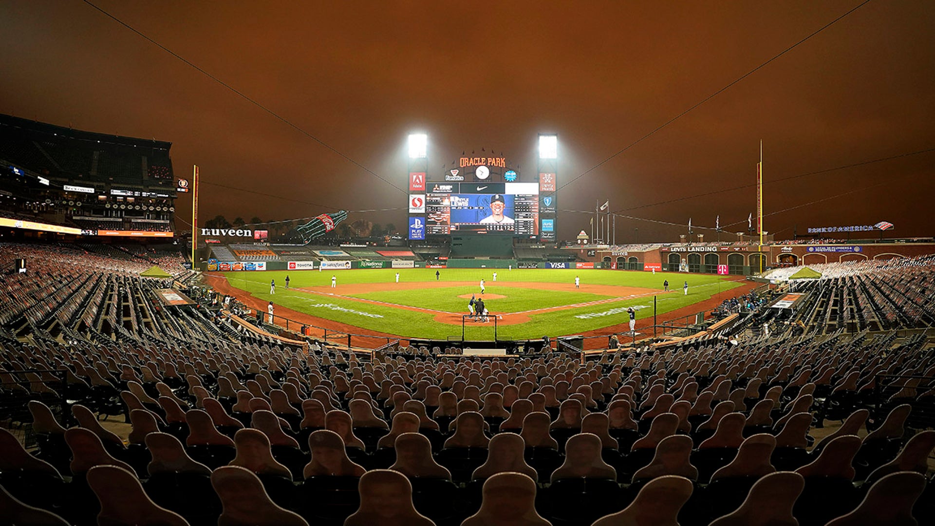 Smoke from California wildfires colors the air above Oracle Park as the San Francisco Giants play the Seattle Mariners during the first inning of a baseball game Wednesday, Sept. 9, 2020, in San Francisco.