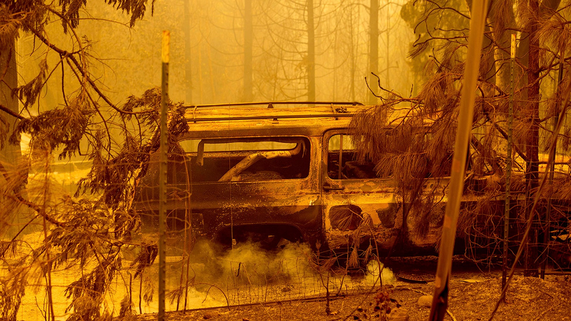 A scorched car rests in a clearing following the Bear Fire in Butte County, Calif., on Wednesday, Sept. 9, 2020. The blaze, part of the lightning-sparked North Complex, expanded at a critical rate of spread as winds buffeted the region.