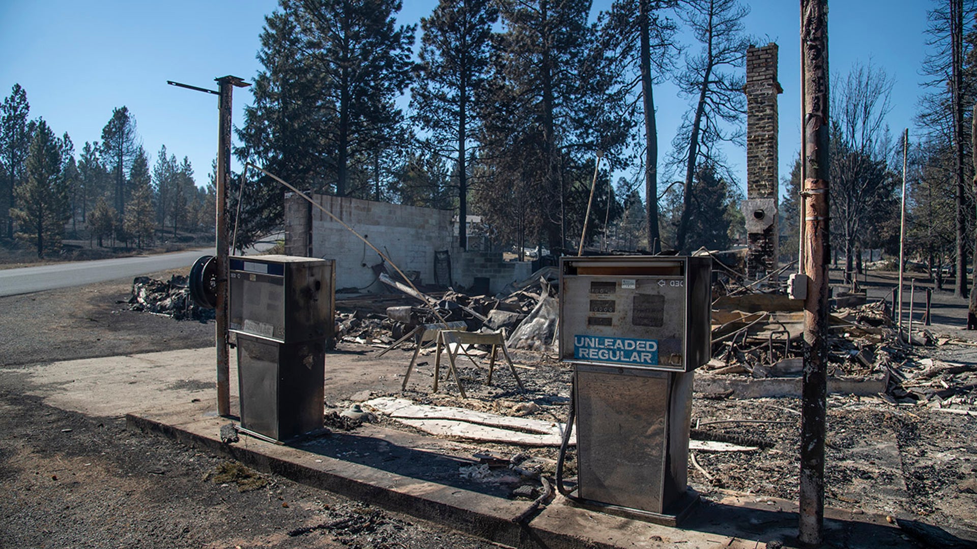 In downtown Malden, Washington, what's left of an old gas station still smolders Tuesday, Sept. 8, 2020, the day after a fast-moving wildfire swept through the tiny town west of Rosalia. Many cars and boats around the building were burned. The town was hit by a wind-driven wildfire Monday that destroyed many structures.