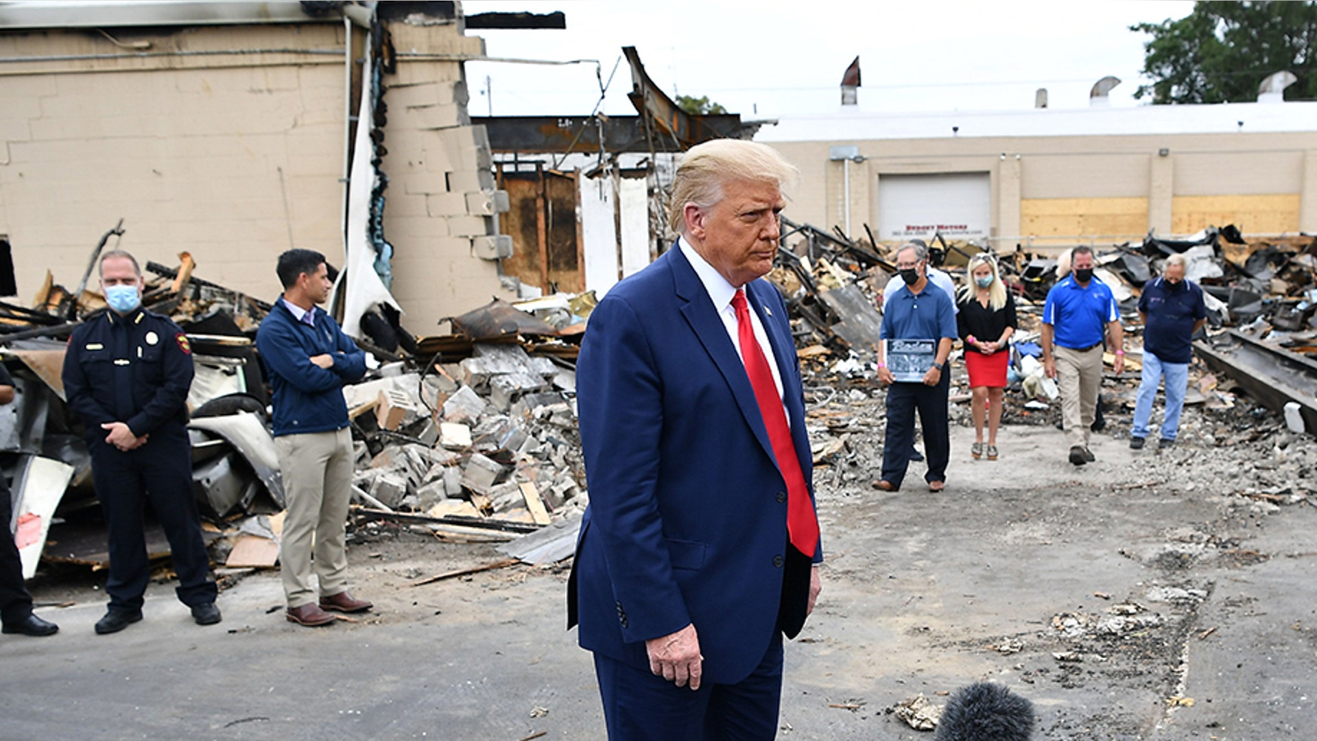 President Trump speaks to the press as he tours an area affected by civil unrest.