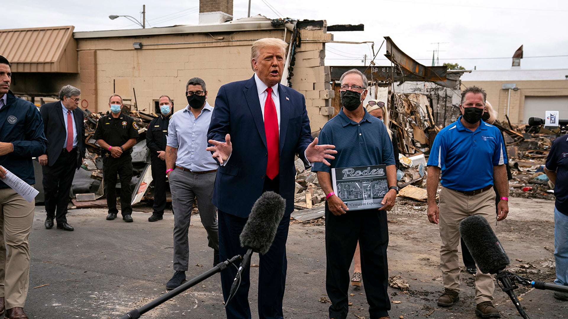 President Donald Trump speaks as he tours an area Tuesday, Sept. 1, 2020, that was damaged during demonstrations after a police officer shot Jacob Blake in Kenosha, Wis. (AP Photo/Evan Vucci)