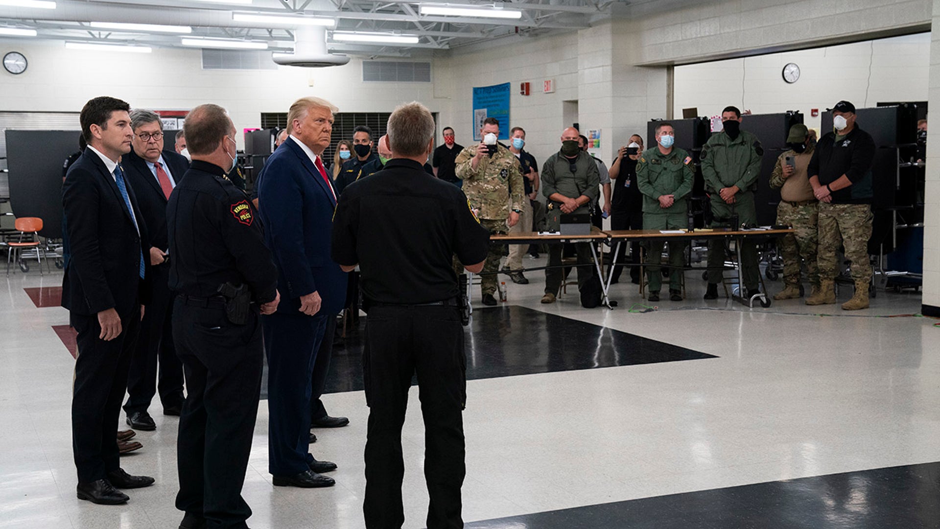 President Donald Trump meets with law enforcement officers at Mary D. Bradford High School, Tuesday, Sept. 1, 2020, in Kenosha, Wis. (AP Photo/Evan Vucci)