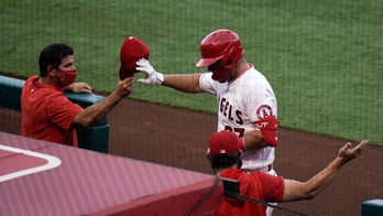 Trout ties Angels' HR record, then scores winning run