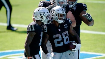 Jacobs runs for 3 TDs as Raiders hold off Panthers 34-30