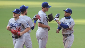 Dodgers 1st team to clinch playoff spot, beat Padres 7-5