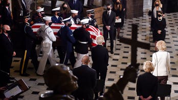 RBG's personal trainer pays homage with a casket-side pushup
