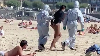 Surfer arrested at Spanish beach after police learn she had coronavirus, was defying quarantine orders