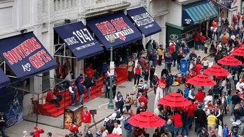 Fan somehow sneaks into Fenway Park, seen screaming at top of Green Monster