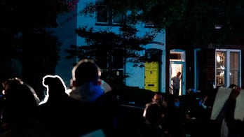 Protesters gather outside Lindsey Graham's home, Supreme Court building