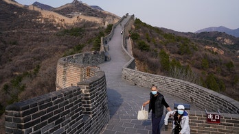 China's domestic tourists to Great Wall warned against climbing 'wild' sections during busy travel week