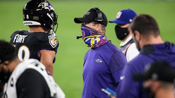 Ravens' John Harbaugh ignites social media criticism for yelling at referee without face covering