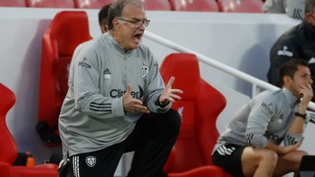 Liverpool wins wild opener, Arsenal coasts as EPL begins