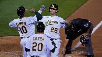 A's clinch playoff berth with win over Giants, Mariners loss