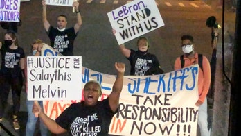 Protesters block buses returning from NBA game, call on LeBron James for help