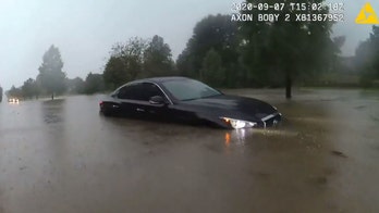 Ohio police officer rescues stranded motorist from flash flooding
