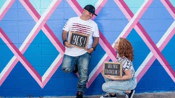 Divorced couple takes part in a photo shoot to celebrate the end of their marriage