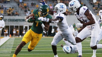 Ebner dominates in Aranda debut as Baylor tops Kansas 47-14