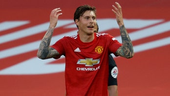 Disjointed and overrun, Man Utd slumps to loss on EPL return