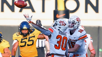 Hubbard, No. 15 Oklahoma State, escape with another victory