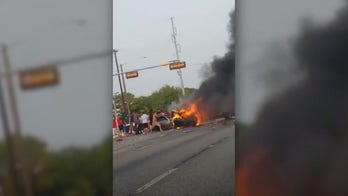 Dallas police, bystanders pull man from burning car after six-vehicle crash, bodycam video shows