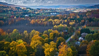 Farmer finds car wedged in his truck, 2 people dead inside