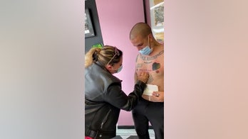 Man proposes to girlfriend with 'Will you marry me?' tattoo on his chest
