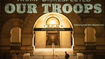 Democrats project campaign messages on Trump Hotel in DC
