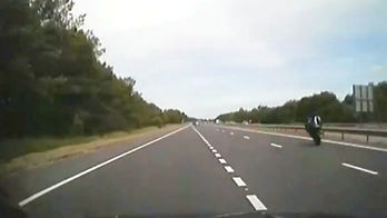 Motorcycle rider caught on dash cam doing 100 mph wheelie past unmarked cop car