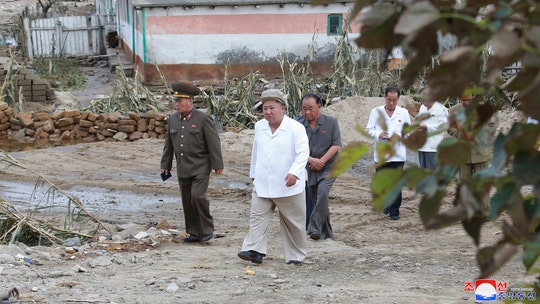 North Korea's Kim Jong Un visits typhoon-hit area after local officials threatened with 'punishment' over storm deaths