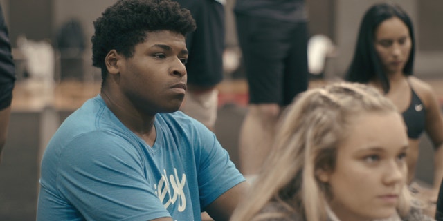 Jerry Harris, left, appears in 'Cheer,' a docuseries on Netflix that follows the competitive cheerleaders of Navarro College in Corsicana, Texas. The 21-year-old was arrested Thursday on one count of producing child pornography.