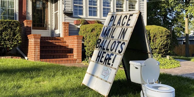 This political yard display was recently set up on West Columbia Street in Mason, Mich. (Matthew Dae Smith/Lansing State Journal via AP)