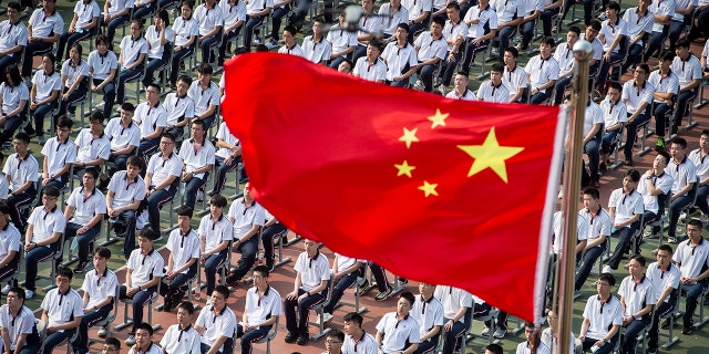 Students attend a ceremony to kick off the new semester in Wuhan High School in Wuhan in central China's Hubei province.