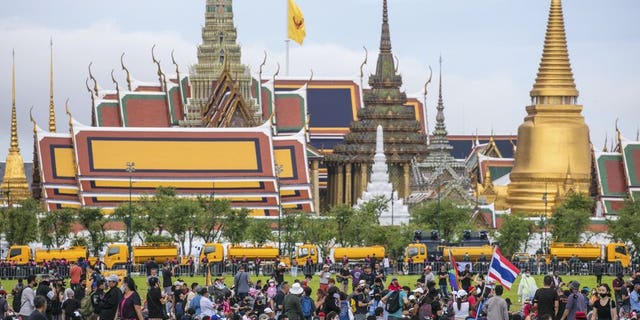 Pro-democracy protesters gather at the Sanam Luang field during a protest in Bangkok, Thailand, Sunday, Sept. 20, 2020. Thousands of demonstrators turned out Saturday for a rally to support the student-led protest movement's demands for new elections and reform of the monarchy. (AP Photo/Wason Wanichakorn)