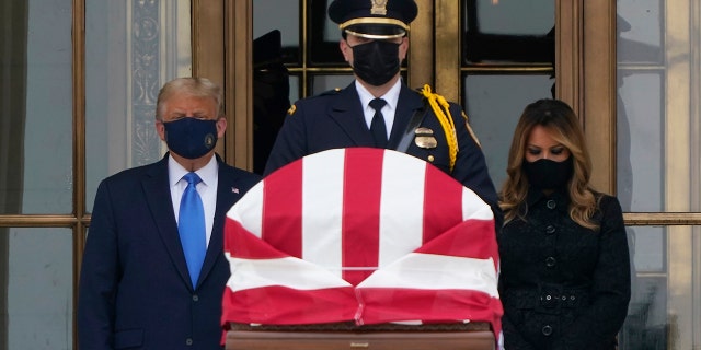 President Donald Trump and first lady Melania Trump pay respects as Justice Ruth Bader Ginsburg lies in repose at the Supreme Court building on Thursday, Sept. 24, 2020, in Washington. Ginsburg, 87, died of cancer on Sept. 18. (AP Photo/J. Scott Applewhite)