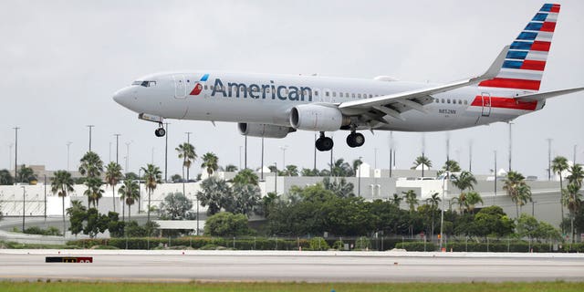 FILE: An American Airlines Boeing 737-823 lands at Miami International Airport, Monday, July 27, 2020, in Miami. 