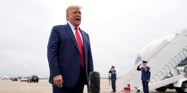 President Trump speaks to the media before boarding Air Force One for a trip to Kenosha, Wis., Tuesday, Sept. 1, 2020, in Andrews Air Force Base, Md. (AP Photo/Evan Vucci)
