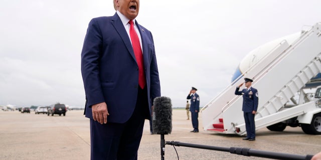 President Trump speaks to the media before boarding Air Force One for a trip to Kenosha, Wis., Tuesday, Sept. 1, 2020, in Andrews Air Force Base, Md. (AP Photo/Evan Vucci)