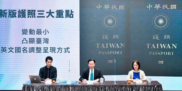 In this Sep. 2, 2020, photo released by the Executive Yuan, Taiwan's Foreign Minister Joseph Wu, center, and Executive Yuan spokesperson Evian Ting, left, and Director of Consular Affairs Bureau Phoebe Yeh attends a news conference to reveal the new Taiwan passport in Taipei, Taiwan. (Executive Yuan via AP)