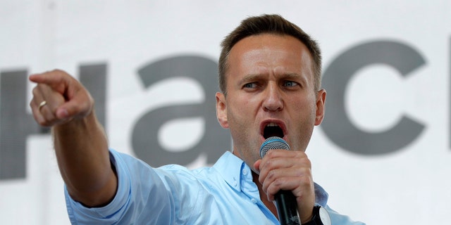 Russian opposition activist Alexei Navalny gestures while speaking to a crowd during a political protest in Moscow, Russia on July 20, 2019. (AP Photo/Pavel Golovkin, File)