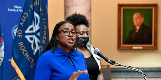 Rochester Mayor Lovely Warren, left, speaks to the media during a press conference in Rochester, N.Y., Thursday, Sept. 3, 2020. (AP Photo/Adrian Kraus)