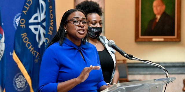 Rochester Mayor Lovely Warren, left, speaks to the media during a press conference in Rochester, N.Y., Thursday, Sept. 3, 2020. (AP Photo/Adrian Kraus)