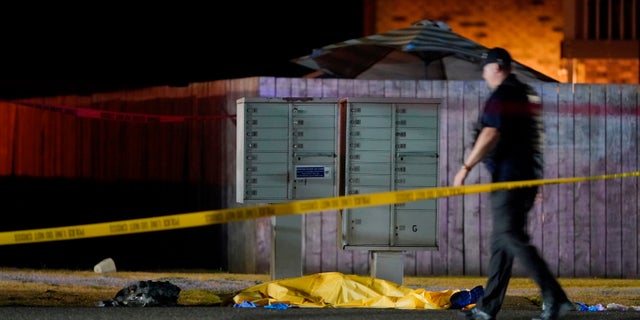 Officials work at the area late Thursday, Sept. 3, 2020, in Lacey Wash., where a man suspected of fatally shooting a supporter of a right-wing group in Portland, Ore. (AP Photo/Ted Warren)