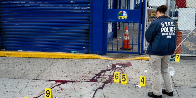 In this Sept 5, 2016, file photo, crime scene investigators with the New York Police Department work at the scene where multiple people were killed and others injured in a shooting during J'ouvert festivities in the Brooklyn borough of New York. NYPD Commissioner Dermot Shea on Tuesday said the department reached a 25-year high in gun arrests last week with 160 people taken into police custody. (AP Photo/Craig Ruttle, File)