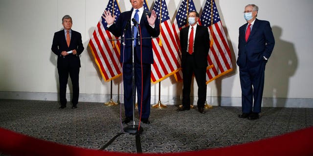 FILE: President Donald Trump speaks with reporters after meeting with Senate Republicans at their weekly luncheon on Capitol Hill in Washington. 