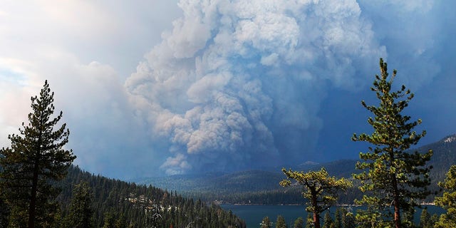 Plumes of smoke rise into the sky as a wildfire burns on the hills near Shaver Lake, Calif., Saturday, Sept. 5, 2020. (Associated Press)