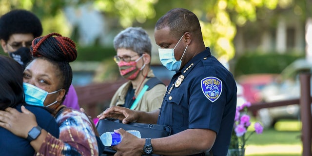 Rochester Police Chief La'Ron Singletary, right, seen before a community meeting in Rochester, N.Y., Thursday, Sept. 3, 2020. (AP Photo/Adrian Kraus)